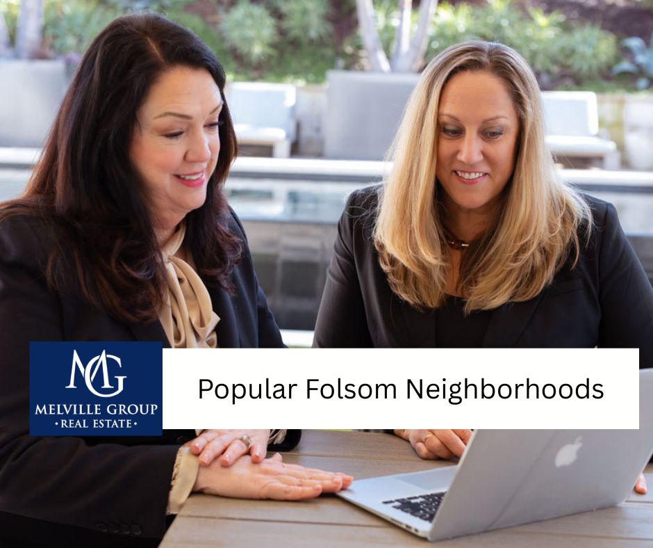 The Melville Group looking at a computer to find Folsom listings